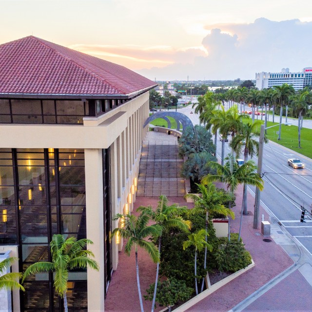 Exterior photo facing west with sunset in the background