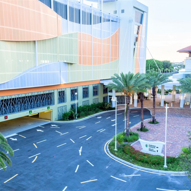 Exterior aerial shot hovering over the parking drive at the southeast entrance for the garage