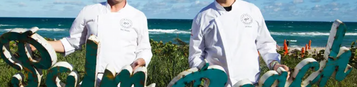 Festival flashback from 2015: Food Network star chefs Marc Murphy and Jeff Mauro pose seaside during the annual Palm Beach Food and Wine Festival. LILA PHOTO, LILA PHOTO