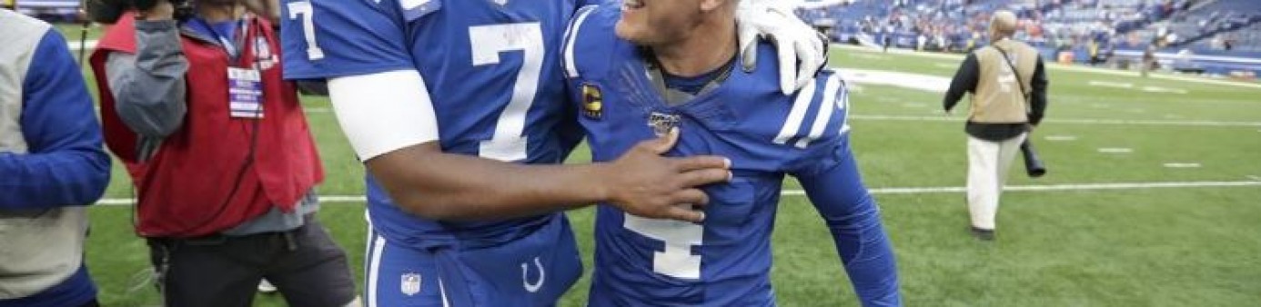 Photograph of Indianapolis quarterback Jacoby Brissett (7) celebrates with kicker Adam Vinatieri (4) following the Colts' 15-13 victory over the Denver Broncos on Sunday. (Michael Conroy/Associated Press) - Michael Conroy 