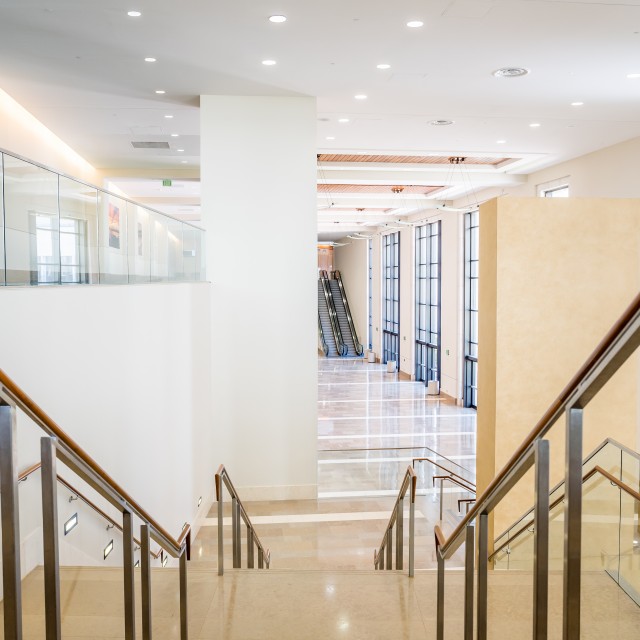 Photo taken from the top of the main staircase overlooking the main lobby on the first floor